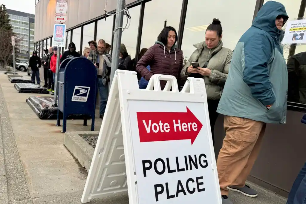 Alaska Division of Elections office exterior with voting rights protest signs