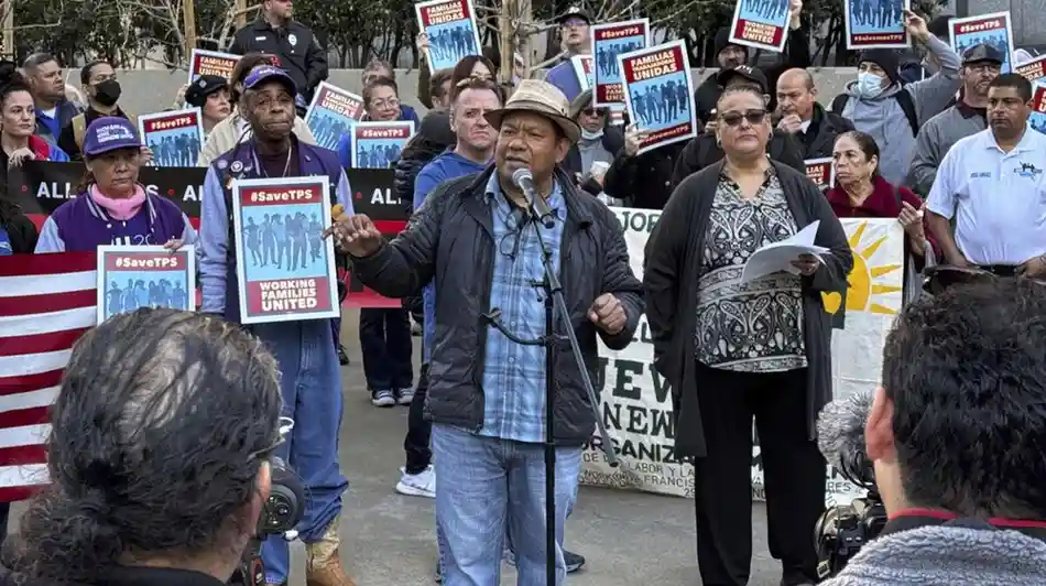 Immigrants and supporters protesting the end of TPS outside a courthouse