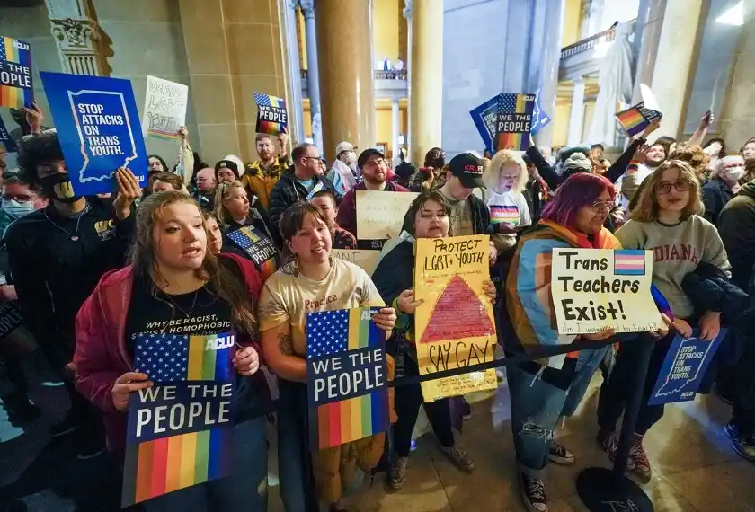 Federal courthouse with rainbow flag and education rights protest signs