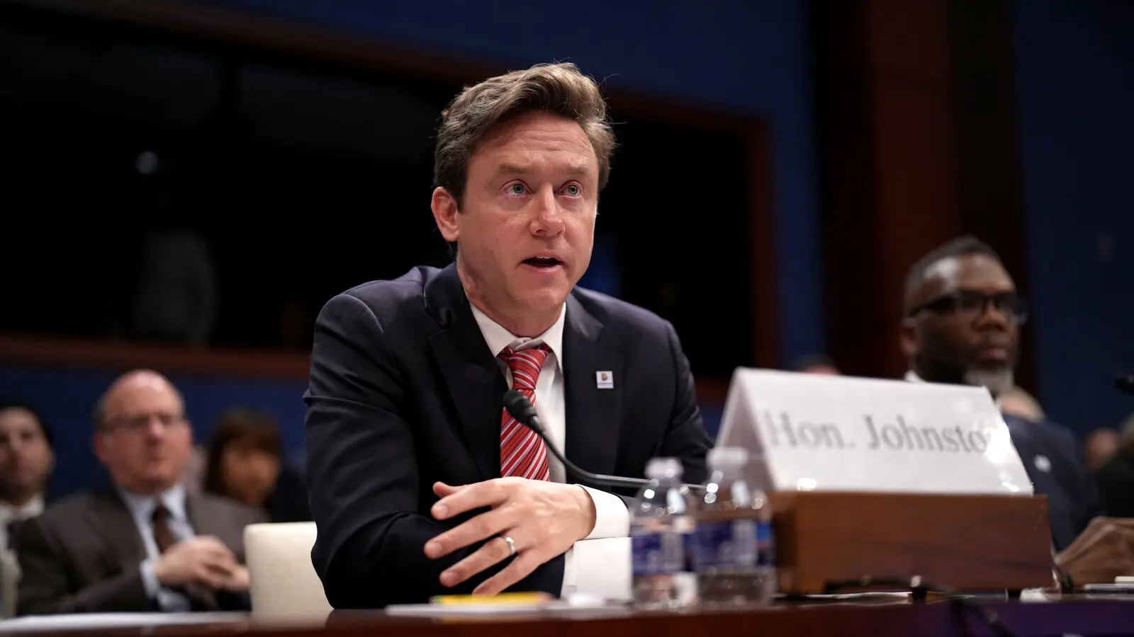 Mayor Mike Johnston at podium announcing order to protect protesters from ICE