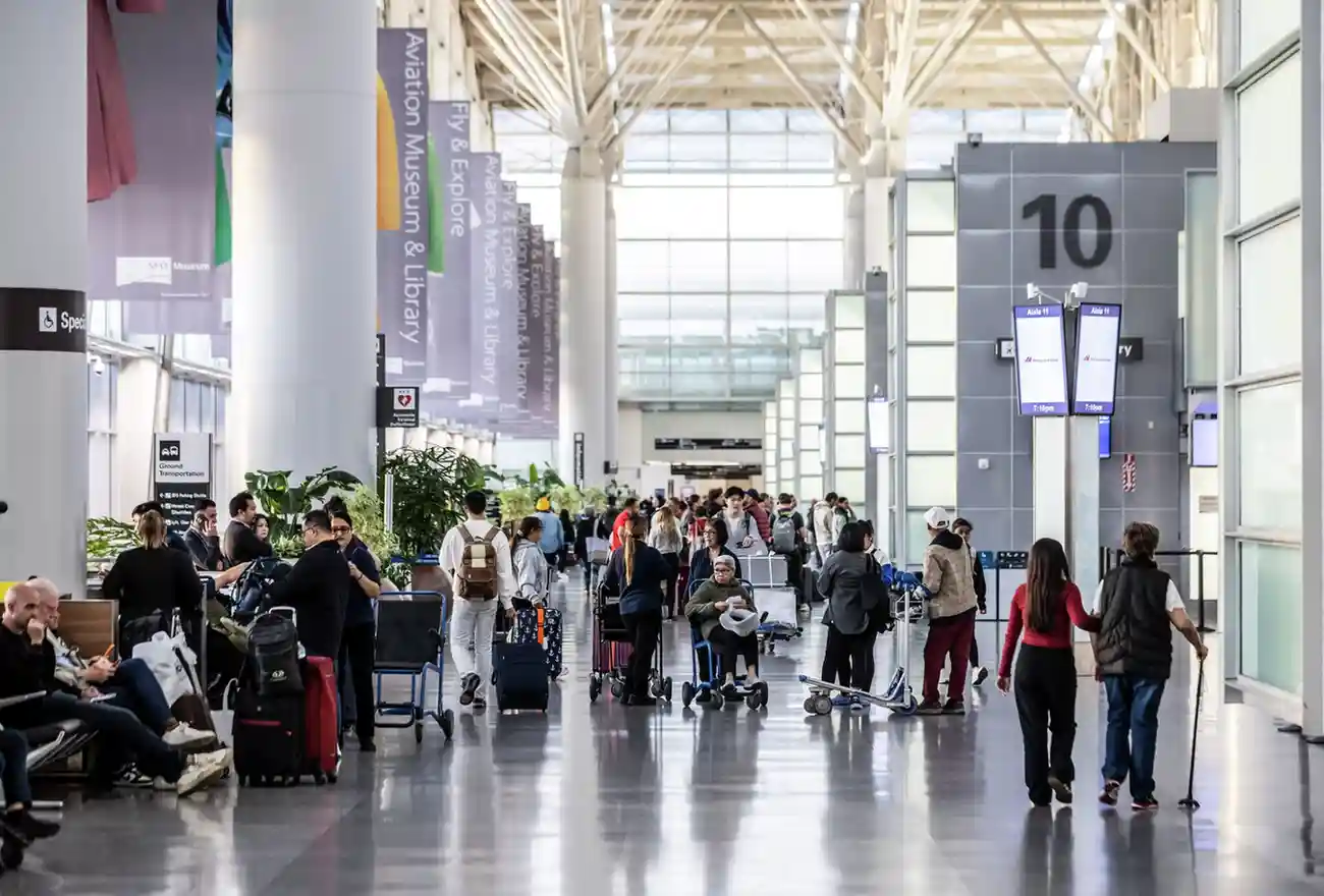 International travelers move through customs at a major U.S. airport as DHS considers withdrawing processing officers from sanctuary city facilities