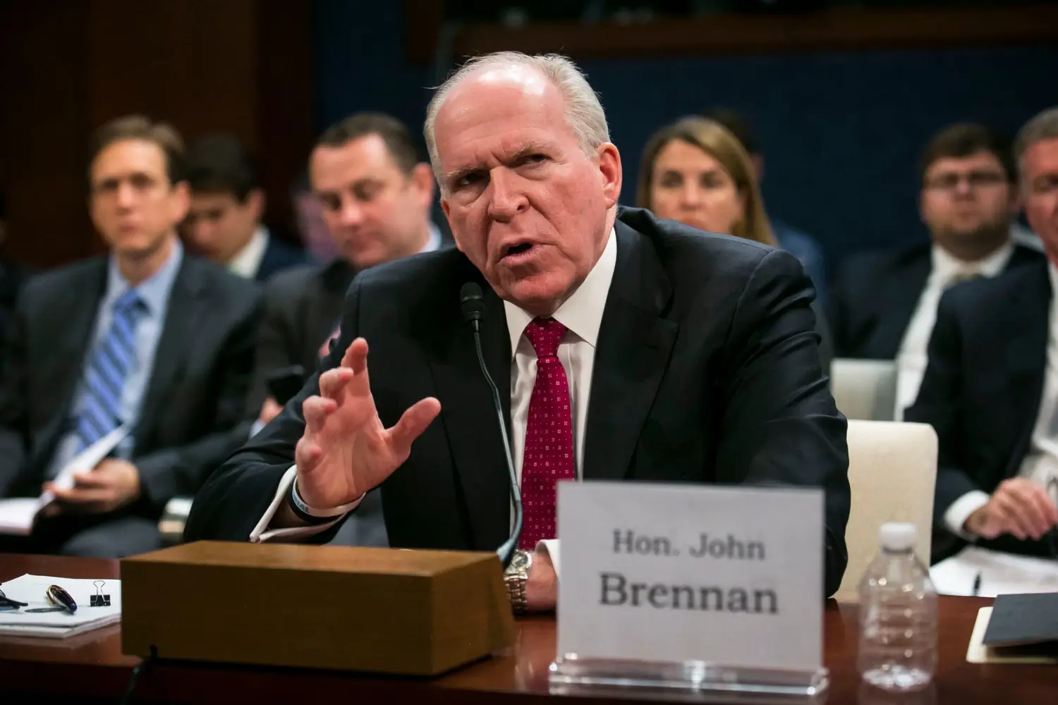 FBI seal and U.S. Department of Justice building representing the criminal investigation into former CIA Director John Brennan over the 2017 Russia intelligence assessment