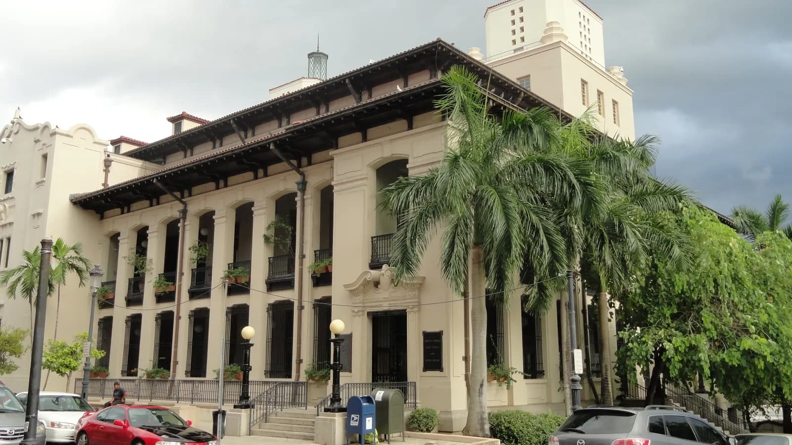 The José V. Toledo Federal Building and U.S. Courthouse in San Juan, with its columned façade and palm trees.