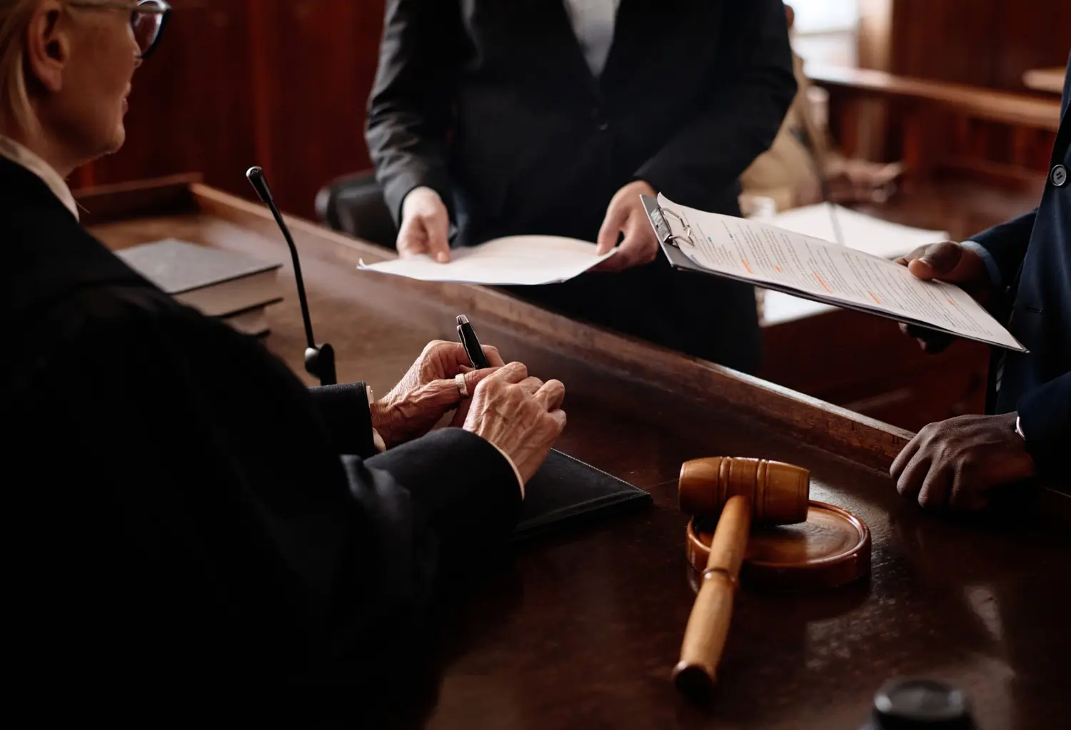 Judges reviewing documents inside a federal appellate courtroom