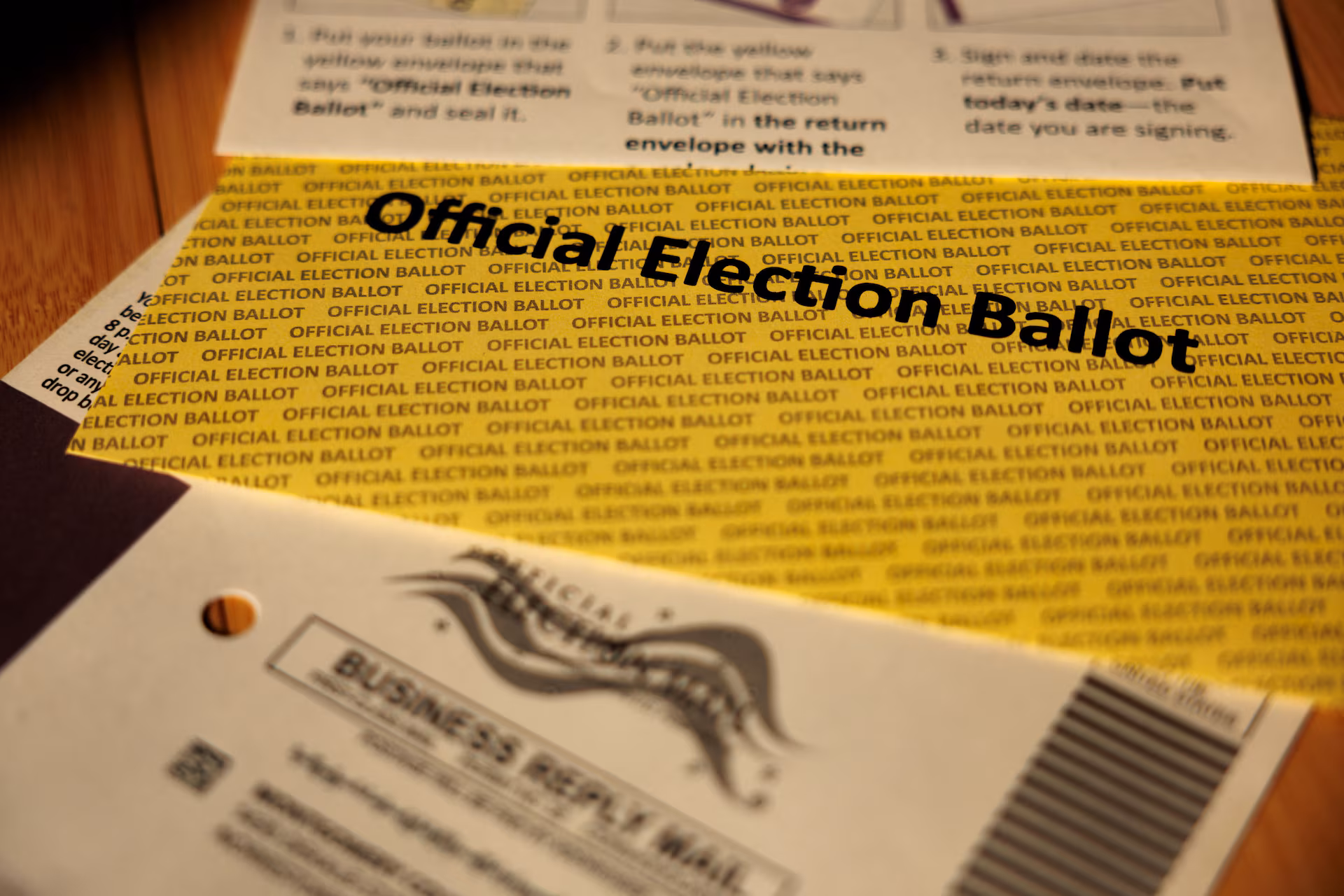 Mail-in ballot being placed in an envelope, illustrating the Postal Service ballot rule dispute