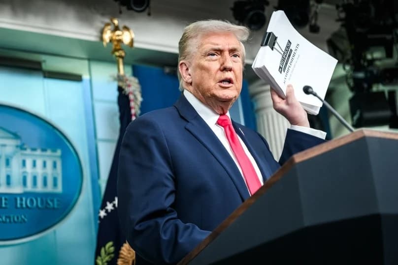President Trump at a podium announcing trade enforcement measures